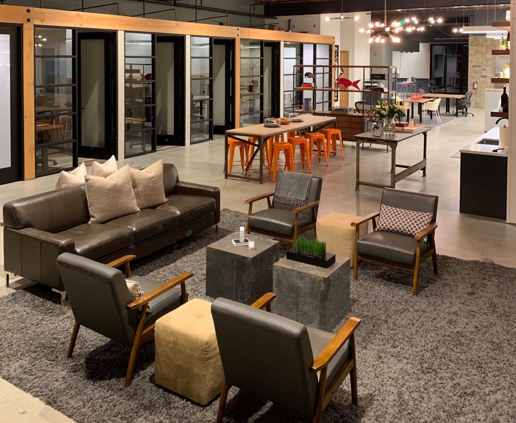 Modern office space with open floor plan, comfortable seating, and industrial-chic decor in Healdsburg, California.