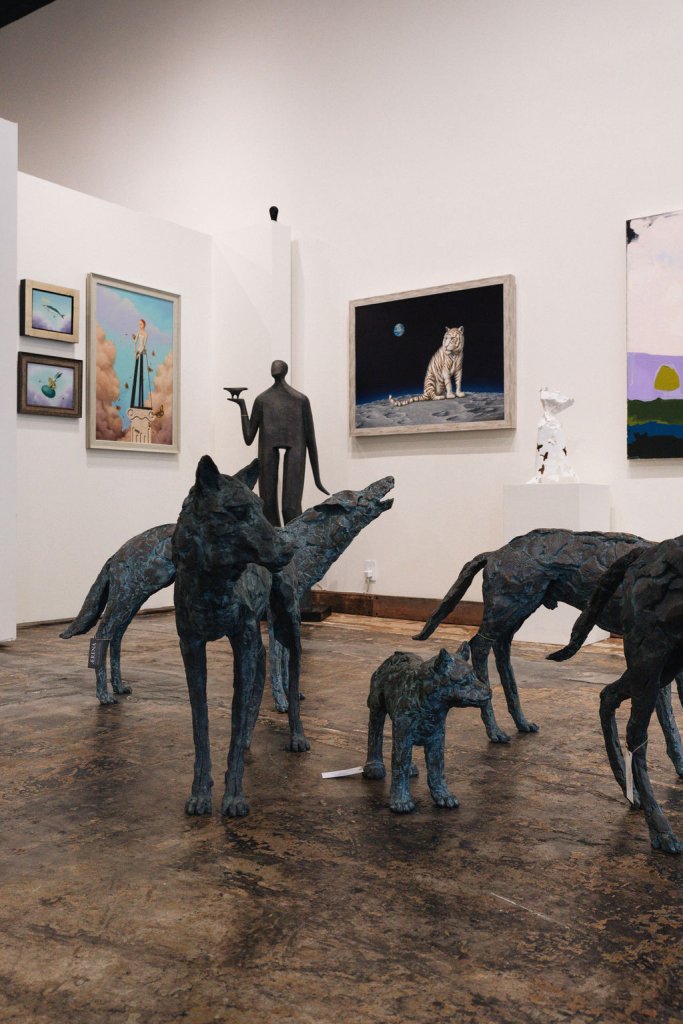 A modern art gallery features abstract animal sculptures, paintings of celestial scenes, and surrealist artworks in Healdsburg, California.