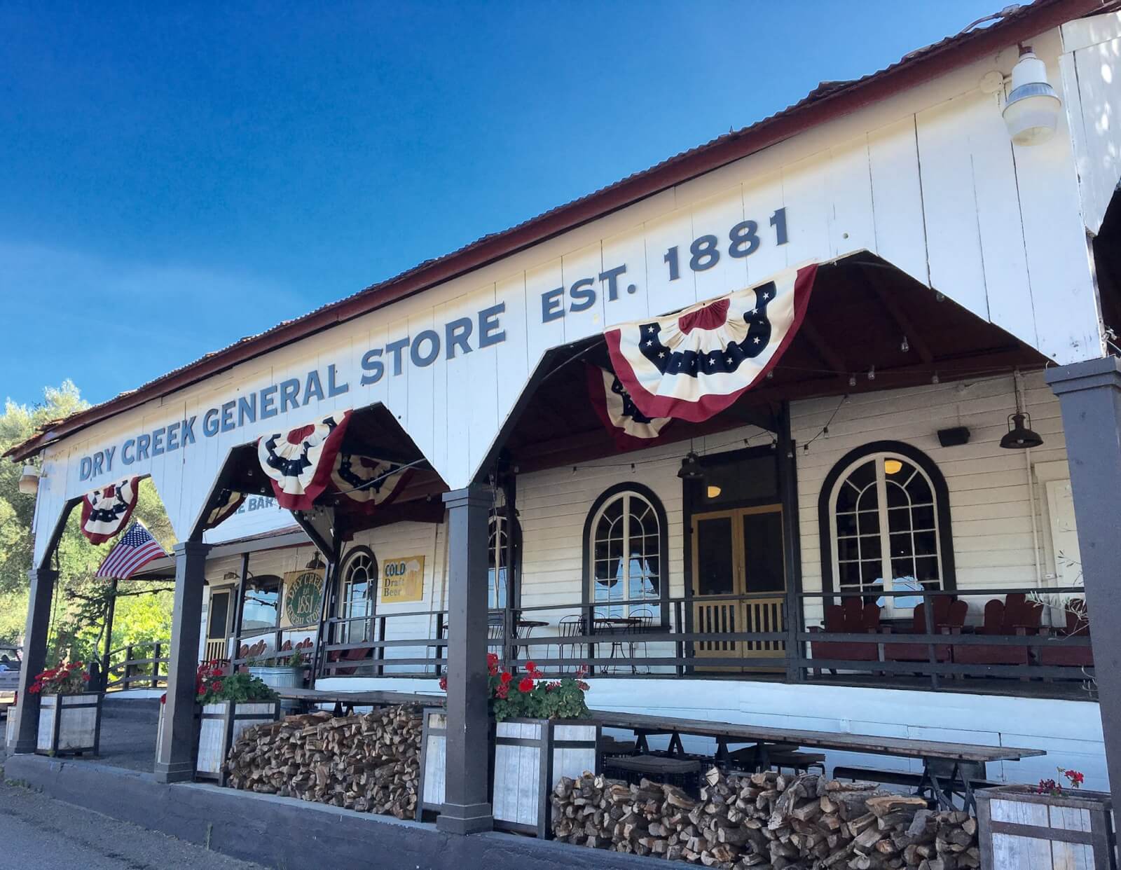 Dry Creek General Store A quaint, historic general store with a covered porch and patriotic decorations in Healdsburg, California.