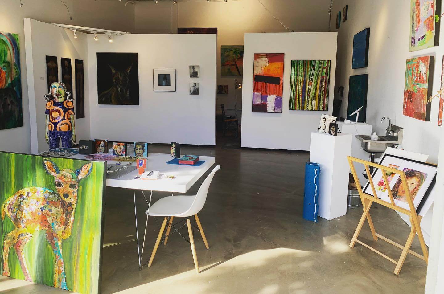 Gallery 300 A vibrant art gallery with colorful paintings, sculptures, and a creative workspace in Healdsburg, California.