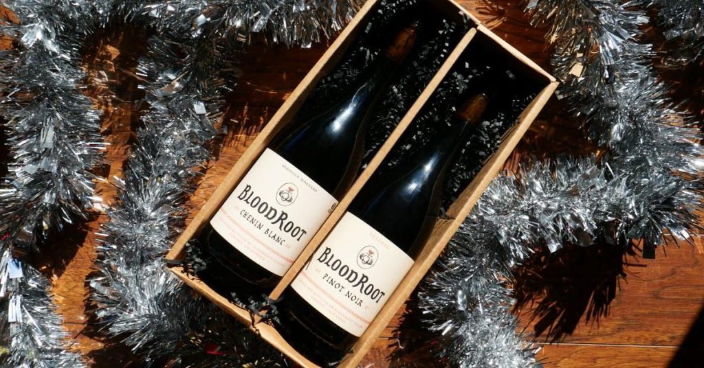 Two bottles of Bloodroot Chenin Blanc wine in a wooden gift box with silver tinsel in Healdsburg, California.