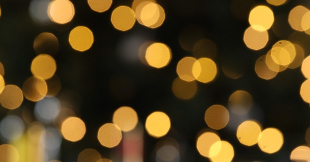 A dark background illuminated by numerous out-of-focus yellow and white lights in Healdsburg, California.