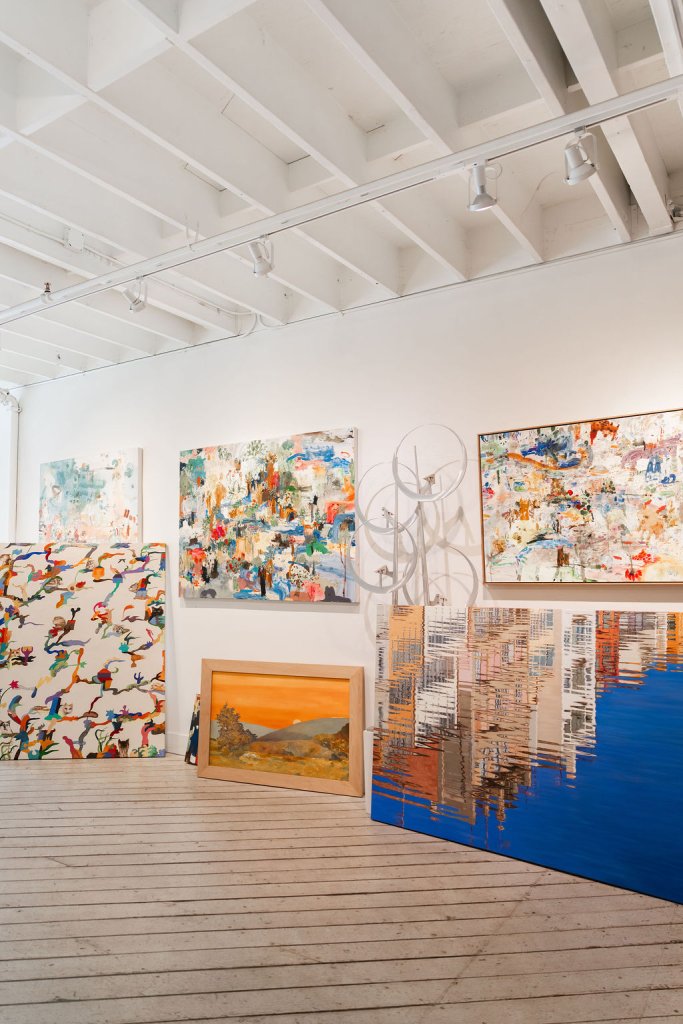 A modern art gallery with colorful abstract paintings and sculptures on display in Healdsburg, California.
