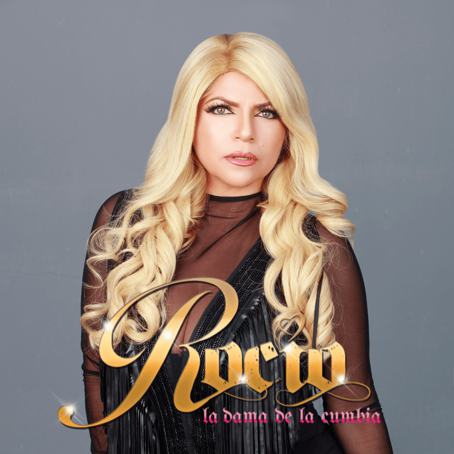 A woman with long blonde hair wearing a black dress with gold lettering that reads 'Rucia, la dama de la cumbia' in Healdsburg, California.
